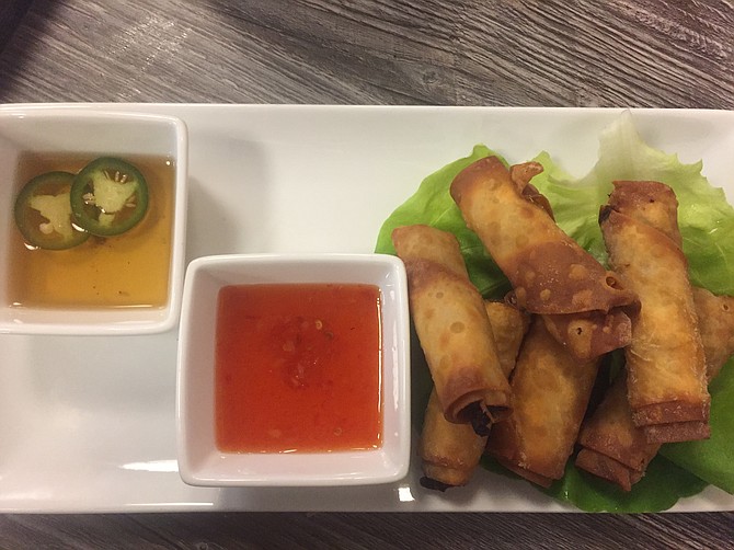 The lumpia comes with two dipping sauces: sweet chili and jalapeño vinegar.