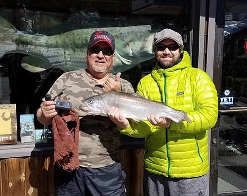 Martin Duran, Devin Ragsdate, and their 7-pound rainbow trout, caught on Big Bear Lake February 16