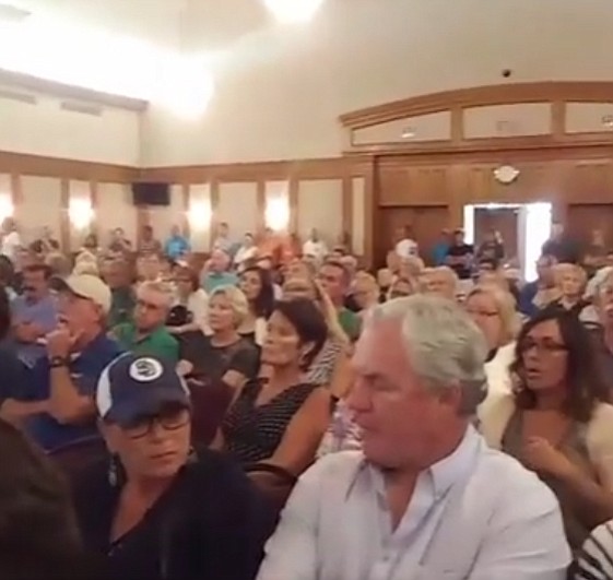 There was standing room only at the town hall in June 2016. The next day the city issued a stop work order. 