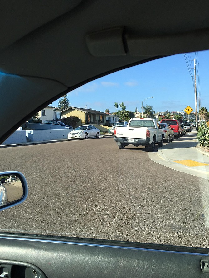 “There are so many cars parked on the street, you can’t see around them, it’s like a great wall, and then you have to just crawl into the intersection and by the time you can see a car coming, you’re in target range of getting hit.”