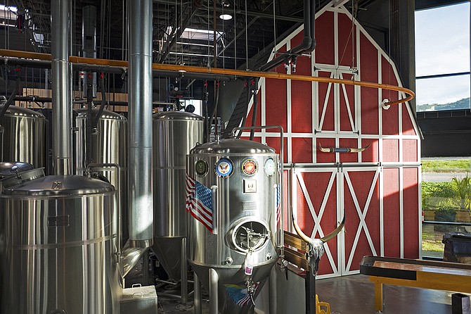The beer made in these tanks is not allowed inside the barn. 