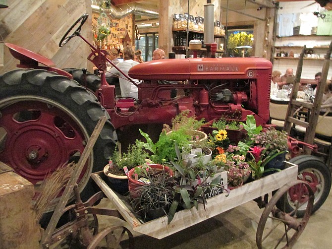 A 1940’s tractor is the centerpiece of the room.

