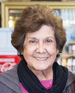 Ofie Escobedo and her sister run Lola’s 7-Up store since the 1980s.