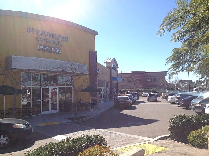 Around 10 A.M., 11 cop cars were on the scene, Starbucks driveway was shut down, customers had to walk in to get coffee