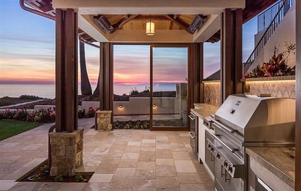 Outdoor kitchen with built-in barbecue and cabana