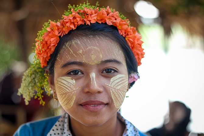 A Burmese girl with thanaka, a commonly used skin care product amongst the Burmese. 