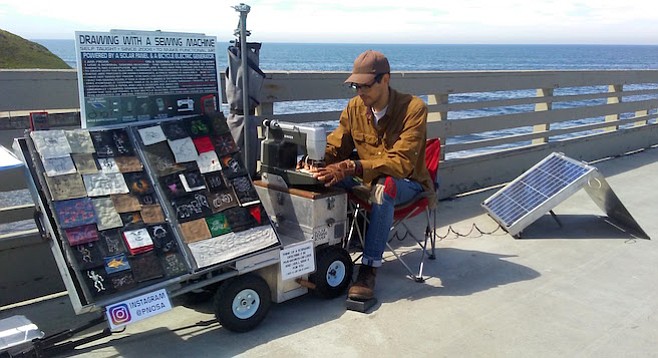 Paul Nosa's sewing trailer is powered by his bicycle's generator and the sun.