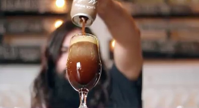 Screencap from Modern Times' video "tutorial on how to pour it like a champion"