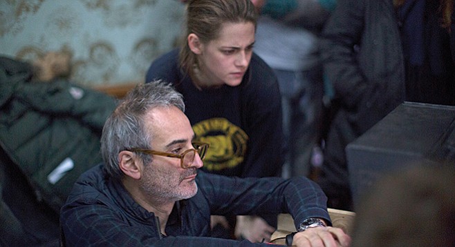 Olivier Assayas and Kristen Stewart consult the video assist during the filming of Personal Shopper.