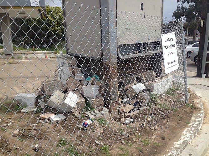 Permanent fencing replaced the rented fencing in March after a car 
made rubble out of the old cinderblock smog check sign out front. 