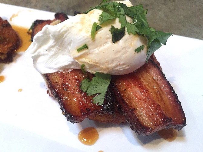 This Pork Belly Benedict forgoes the English muffin for a potato cake and the hollandaise for a maple glaze