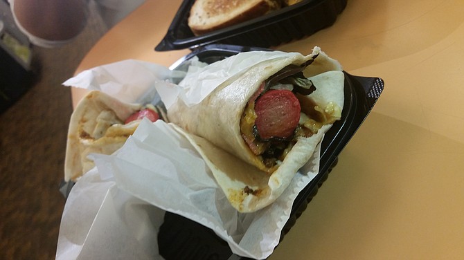Chili Dog Burrito topped with pastrami and lettuce