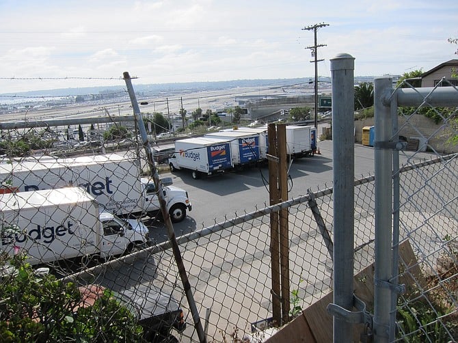 Truck rental lot from top of W Olive Street, view of airport. 