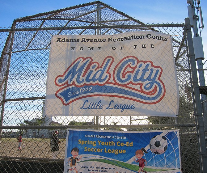 Kids were playing ball in field next to homeless camp. 