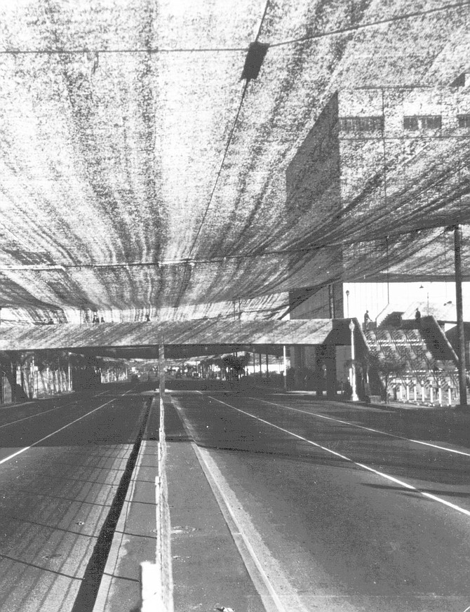 Pacific Highway with canopy. The city ordered air-raid drills and frequent blackouts and camouflaged the aircraft industries with netting and dummy trees on the rooftops and roads. 