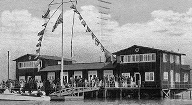 San Diego Yacht Club, 1935. At first, the clubhouse was “situated over water and required trekking over mud for access.”  - Image by San Diego Yacht Club