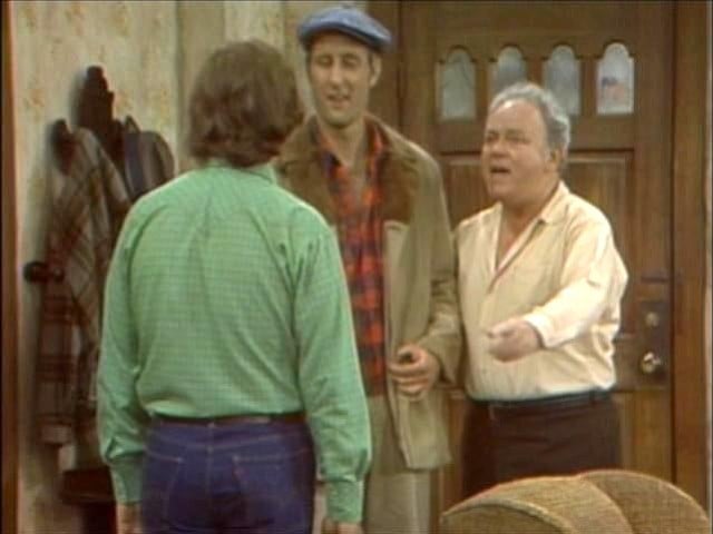 Meeting of the Meatheads: Archie (Carroll O’Connor) introduces son-in-law Mike (Rob Reiner) to co-worker/funniest man on earth, Stretch Cunningham (James Cromwell).