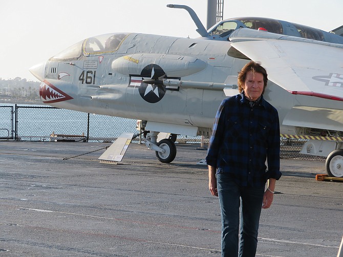 Rock and roll Hall-of-Famer John Fogerty sings "Love and War" on the flight deck of the USS Midway (Photo by Patty Mooney)
