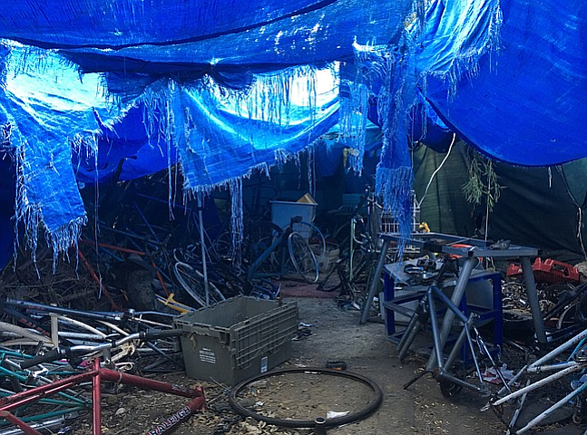 Homeless camp with hundreds of stripped down bicycles discovered along the San Diego River last week. 