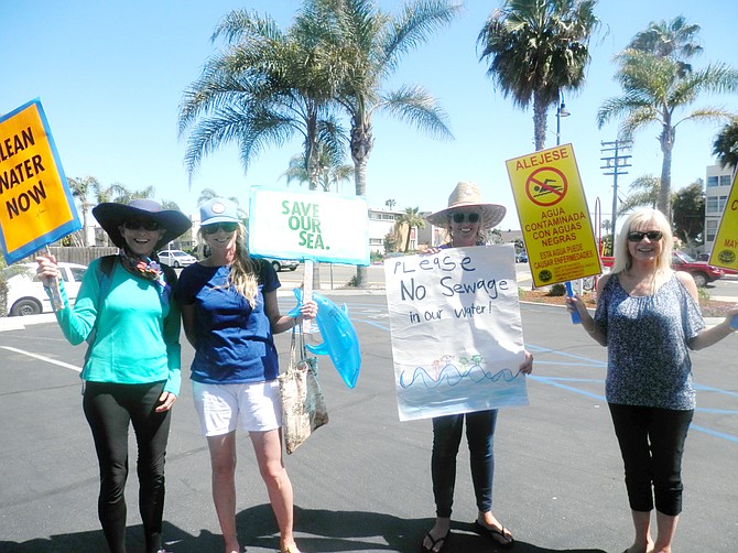 Coronado Marchers Hold Up Signs For Clean Water March Last Saturday