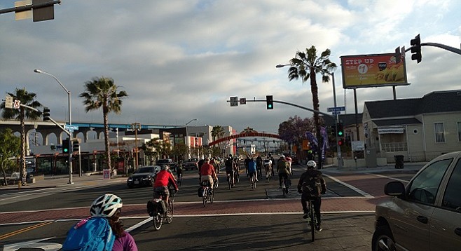 Bikes and cars commingle on Cesar Chavez Parkway in Barrio Logan