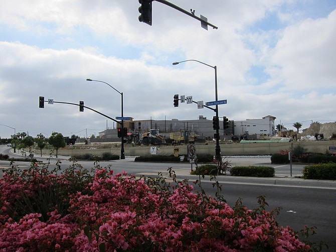 A lot of action on Village Center Loop Road - directly across from the middle school and soon-to-be park is The Village, a shopping center that will house the future civic use space and future library.