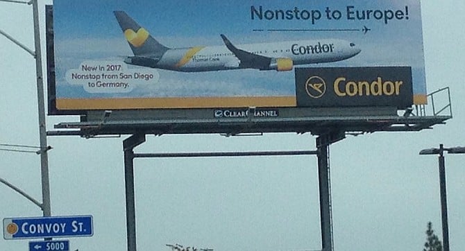 Billboard on Convoy St. A one-week trip to Frankfurt, booked two weeks in advance, would run $619.98.