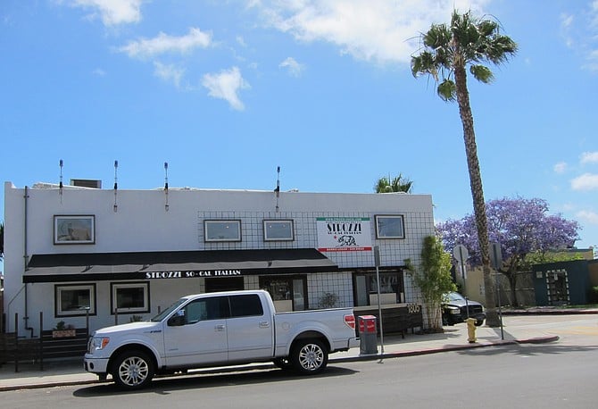 Strozzi across the street serves beer and wine. Their liquor license expires July 2017. 