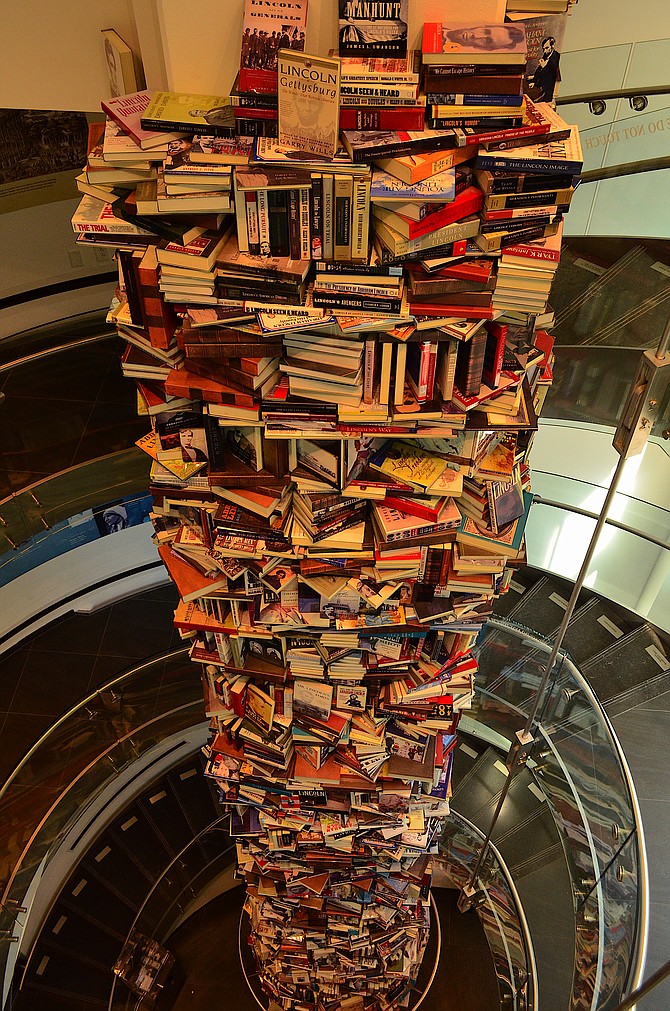 This 34-foot tall tower of books about Abraham Lincoln is located at the Ford's Theater Center for Education and Leadership in Washington DC, just off the National Mall.  There are 7,000 books in the tower (of the 15,000 that have been written about Lincoln since his assassination).  The tower was completed in 2012. The books are made of aluminum with real book covers glued on top of them.  