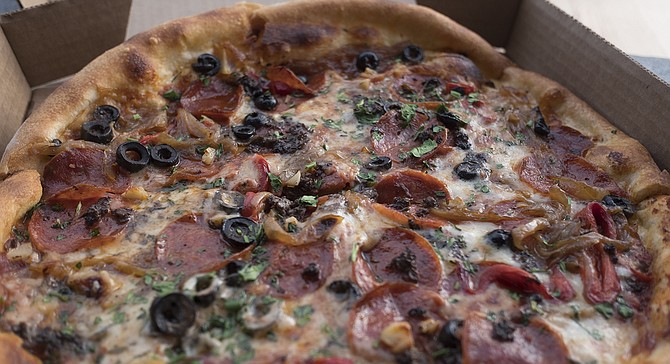 The Classic has a regular pepperoni-and-mozzarella base plus caramelized onions, roasted bell peppers, fresh herbs, and olives.