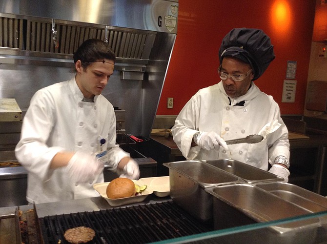Dustin and Ernest assemble my chicken burger