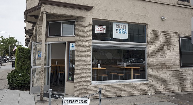 A small window sign marks the location of Craft & Sea