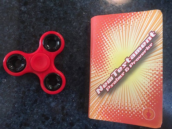 Fidget spinner shows size of free New Testament