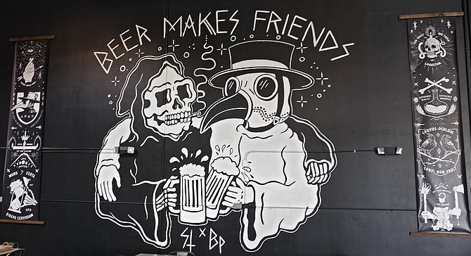 A mural in the Black Plague tasting room by CEO Jarred Doss