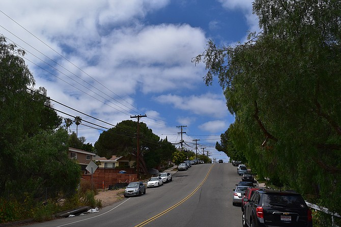 Blue skies, puffy clouds, curvy streets, pepper trees, and telephone poles.  Richmond Street.  Just south of Hillcrest.  June 2017