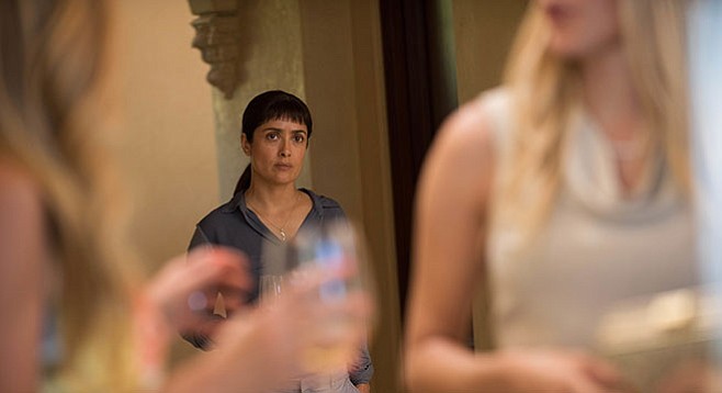 Beatriz at Dinner: Beatriz (Salma Hayek) and her bangs transition from unplanned guest to displeased dinner companion in Miguel Arteta’s drama.