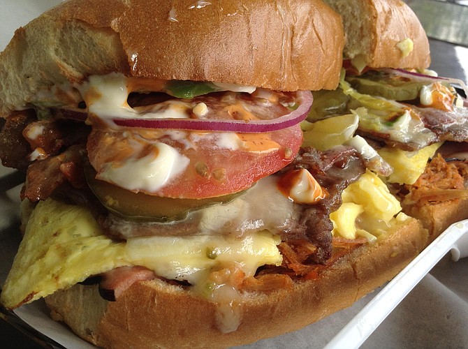 Big slab of egg with pepper jack gives the torta a breakfast flavor.