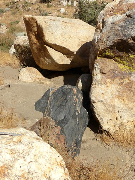 The dark canyon rocks are hornblende biotite