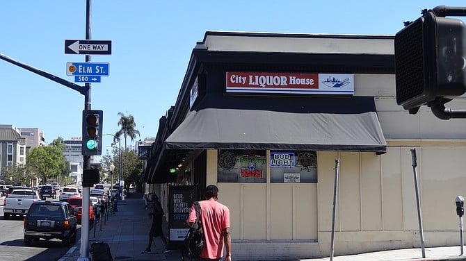 David Somo, manager of City Liquor House, said CVS can easily undercut his prices on liquor and groceries. 