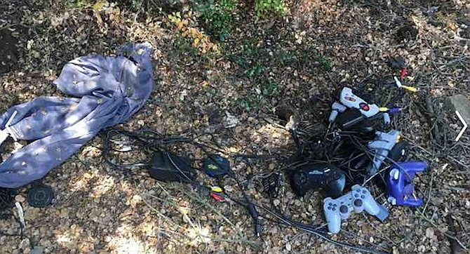 There was charred wood and other burnt remnants, an abandoned tent, a bunch of trash — and Nintendo and Sega Genesis video game controllers