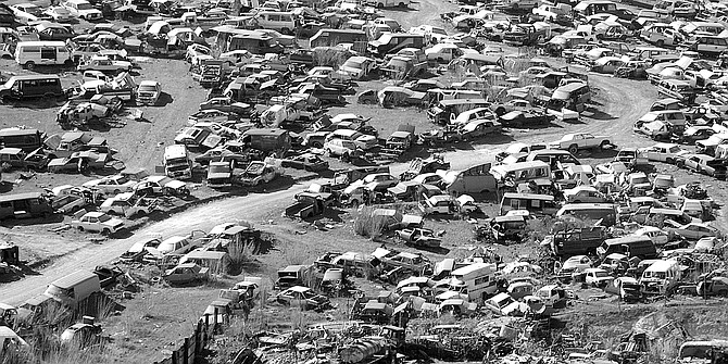Cars sit in huge yards on the periphery of the city — near the Rodriguez dam and in  La Gloria. - Image by Joe Klein