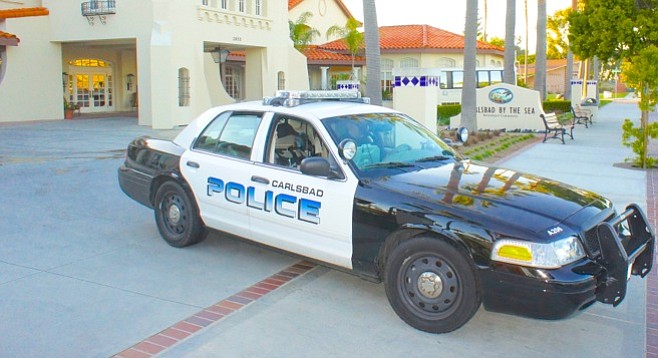 Officer Horton approached the Jaguar with fogged windows.