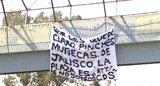 On June 30th, on a pedestrian bridge a narco-banner threat read “Let it be clear you sissy dolls from Jalisco, the plaza is ours.” 
