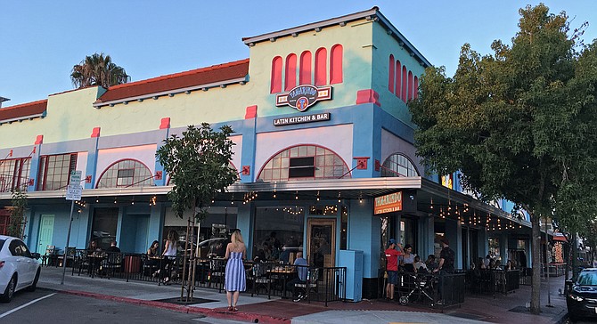 A colorful exterior draws a Friday-night crowd to Tamarindo