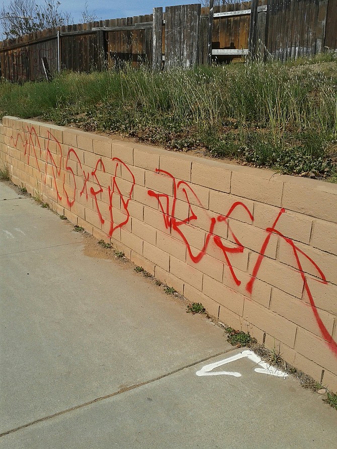 Wall on the corner of Citracado Parkway and West Valley Parkway after a tagger had at it.