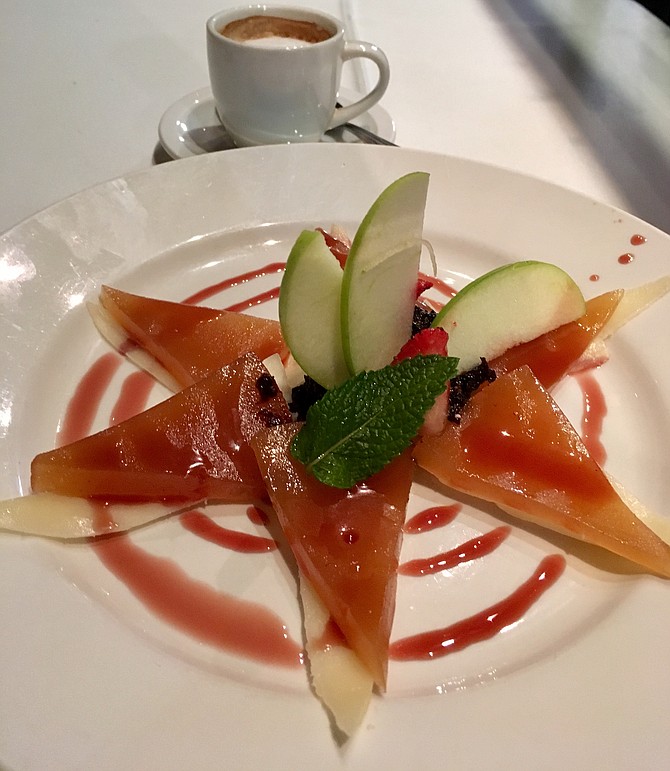 Ate con queso is a traditional dessert of guava paste, quince cheese, and manchago cheese served with fig compote, fresh fruit, and port-wine honey