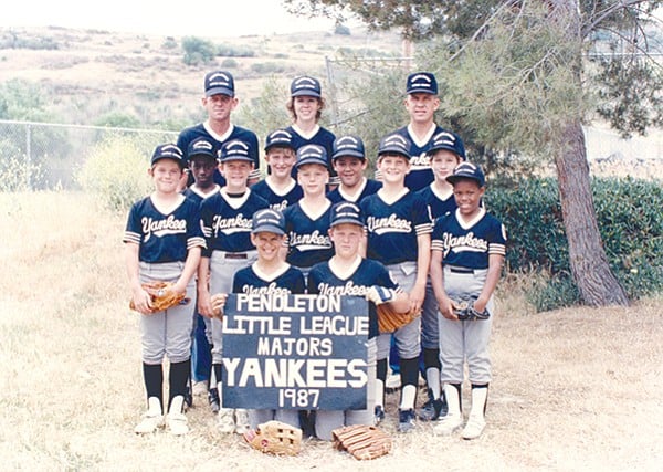 Author Ian Anderson’s Little League baseball team (Anderson on far right, below adult).