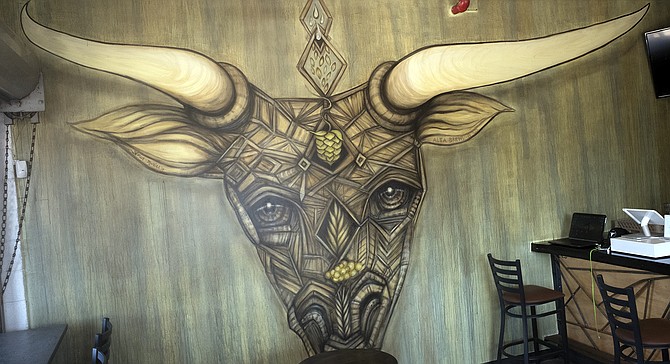 Alta brewing's tasting room is dominated by this mural by local artist Gloria Muriel.