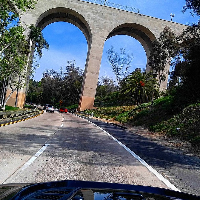 Those driving under the iconic bridge probably have no idea they are also passing by a homeless camp. (photo courtesy Javier Mendoza)