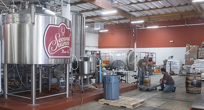 Marty Mendiola and Peter Zien discuss Belgian yeast during a collaboration brew day at Second Chance Beer Co.